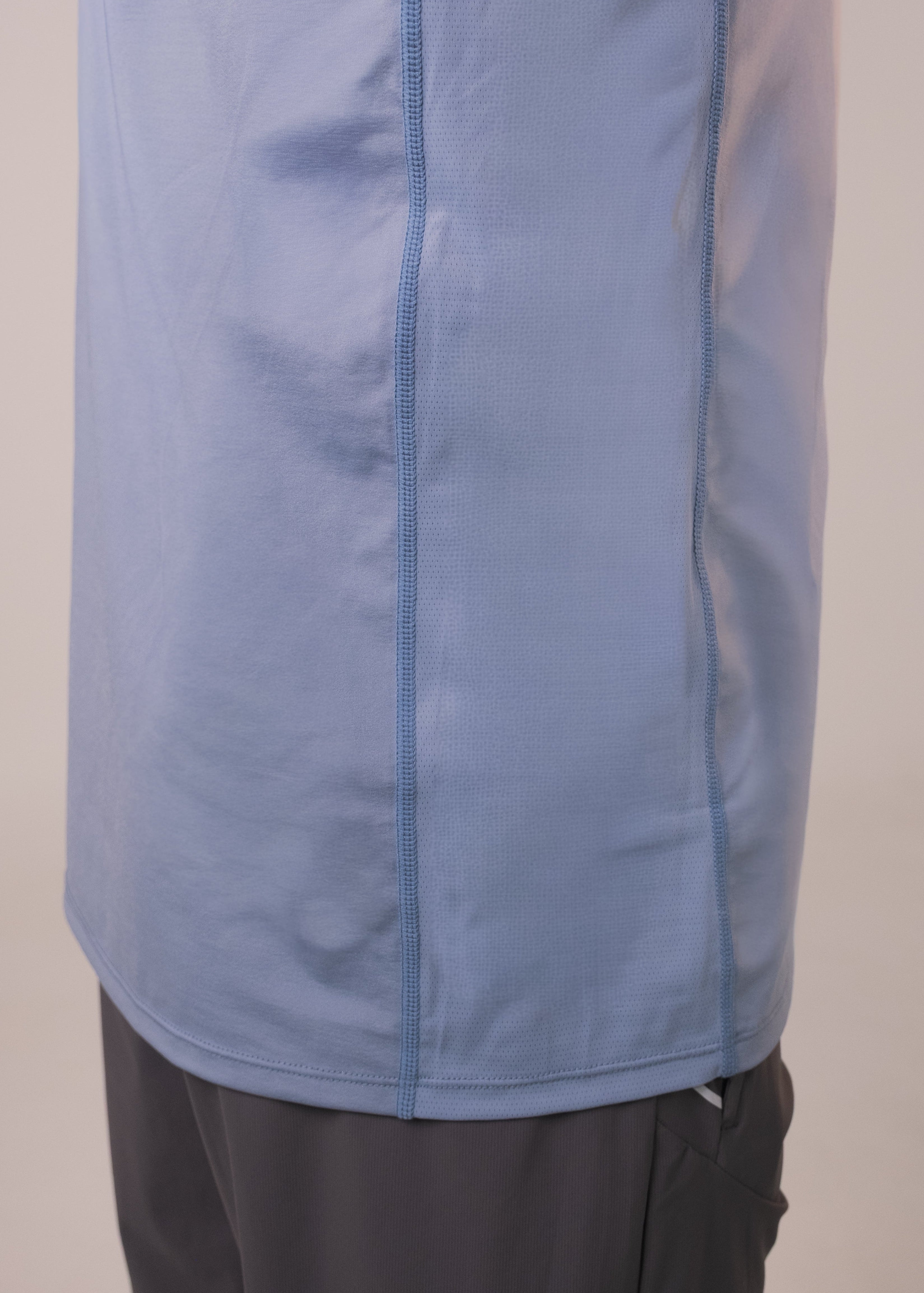Blue jacket with a zipper on a plain background